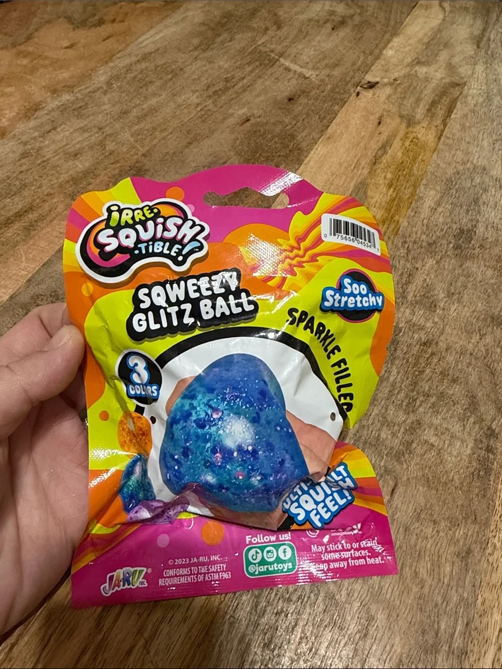 Irresistible Squishy Tible Squeezy Glitz Ball - Orange Sparkle